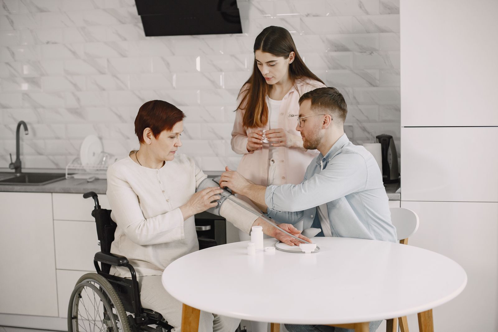 A carer supporting an older couple at home.